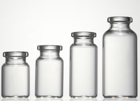 Clear glass vials of ascending sizes